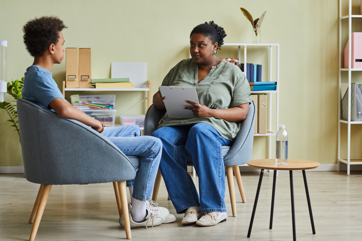 Social worker talking to troubled teenager