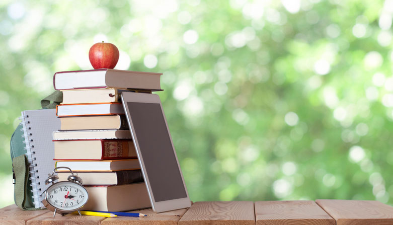 school books, supplies, and apple