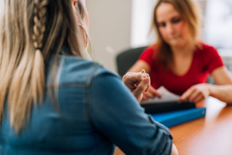 social worker interviewing woman