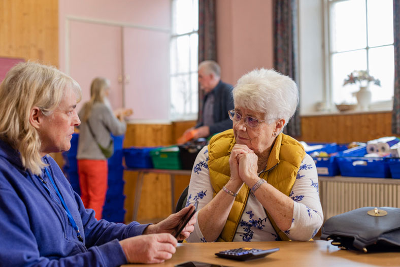 financial social worker with elderly woman