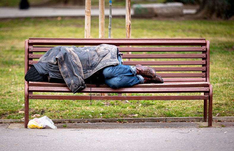 homeless man on bench