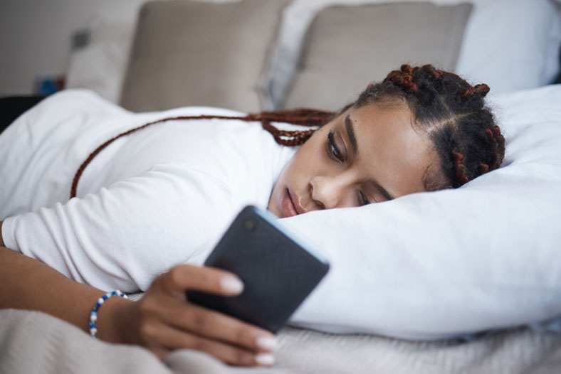 depressed woman in bed